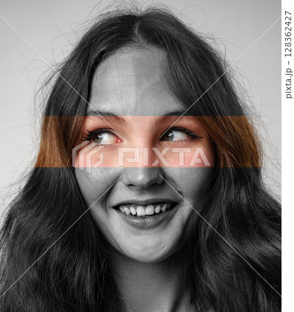 Engaging portrait of a young woman with expressive eyes and a playful smile in a creative art setting Engaging portrait of a young woman with expressive eyes and a playful smile in a creative art setting 128362427