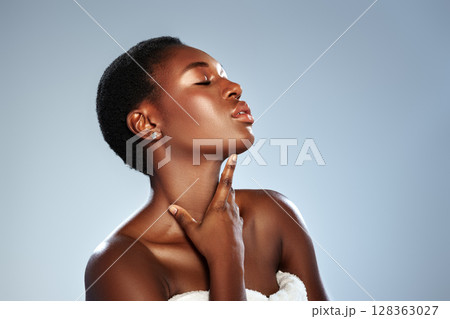Elegant woman poses for beauty portrait with flawless skin, showcasing graceful expression in studio setting Elegant woman poses for beauty portrait with flawless skin, showcasing graceful expression in studio setting 128363027