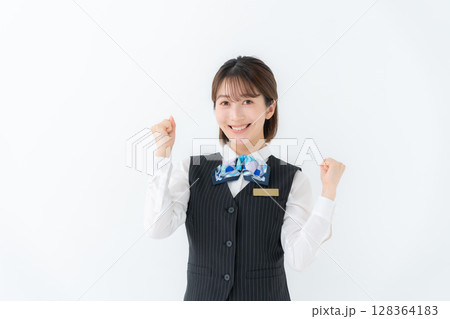 制服の若い女性　ビジネス　ガッツポーズ 128364183