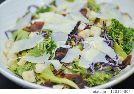 caesar salad or vegetable salad with bacon and cheese 128364804
