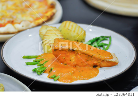 grilled salmon,salmon steak or fish steak and salad grilled salmon,salmon steak or fish steak and salad 128364811