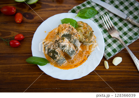 Hot zucchini baked in the oven with sauce Hot zucchini baked in the oven with sauce 128366039