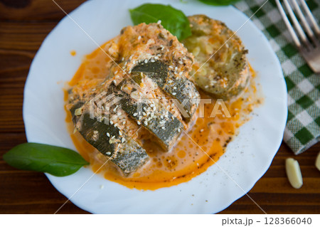 Homemade warm dish of zucchini with herbs 128366040