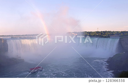 Hornblower Boat sailing on the Niagara River with rainbow and Horseshoe Falls on the background in Ontario, Canada 128366338