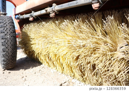 Closeup of a heavyduty road sweeper brush highlighting its robust design and functionality Closeup of a heavyduty road sweeper brush highlighting its robust design and functionality 128366359