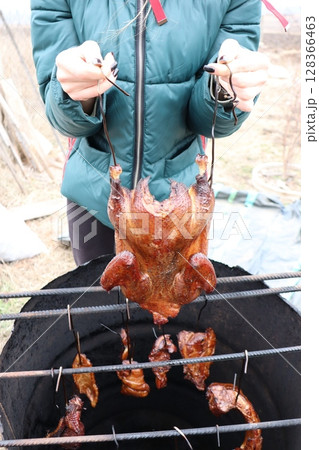 Deliciously Roasted Chicken Cooked to Perfection on a BBQ Grill in Your Backyard or Park Deliciously Roasted Chicken Cooked to Perfection on a BBQ Grill in Your Backyard or Park 128366463