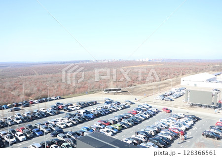 An Aerial View of a Spacious Parking Lot Nestled Within a Scenic and Beautiful Landscape An Aerial View of a Spacious Parking Lot Nestled Within a Scenic and Beautiful Landscape 128366561