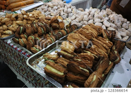 A Wonderful Selection of Delicious Assorted Pastries and Snacks Displayed at a Local Market 128366654