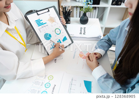 Business Meeting with Data Analysis and Strategy Planning in Modern Office Environment Business Meeting with Data Analysis and Strategy Planning in Modern Office Environment 128368905