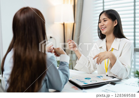 Business Strategy Planning Meeting with Financial Reports and Data Analysis Charts in Modern Office Business Strategy Planning Meeting with Financial Reports and Data Analysis Charts in Modern Office 128369588