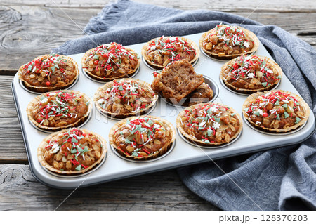 banana bread oat muffins with christmas sprinkles banana bread oat muffins with christmas sprinkles 128370203