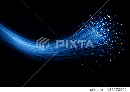 AI generated image showing glowing fiber optic strands flowing across a dark background symbolizing high speed data transmission digital connectivity and abstract technology energy AI generated image showing glowing fiber optic strands flowing across a dark background symbolizing high speed data transmission digital connectivity and abstract technology energy 128370962