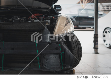 Checking car body work fiber bumper at car garage Checking car body work fiber bumper at car garage 128371299