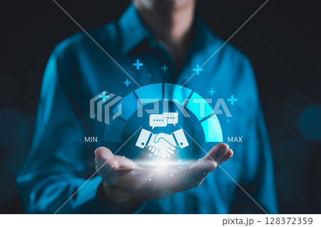 Trusted Partner and Business Collaboration Concept. Businessman holding handshake icon with trust level gauge, representing business partnership, reliability, professional transparency trustworthy, 128372359
