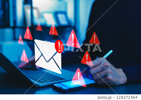 Email security threat notification and spam warning concept. A person using smartphone with icons of mail envelopes showing red warning symbols represent potential email security threats, spam alerts, 128372364