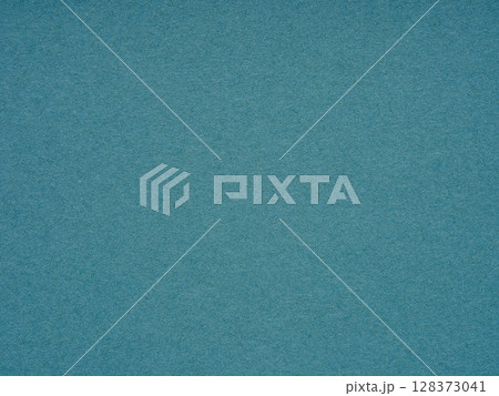 Swept in a sea of teal, the paper texture reflects the tranquil depths and serene mysteries of ocean waters 128373041
