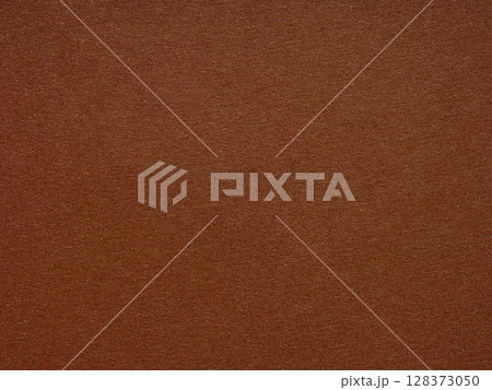 A rich terra cotta canvas, the paper's texture beckons with earthy warmth and an ancient, enduring charm 128373050