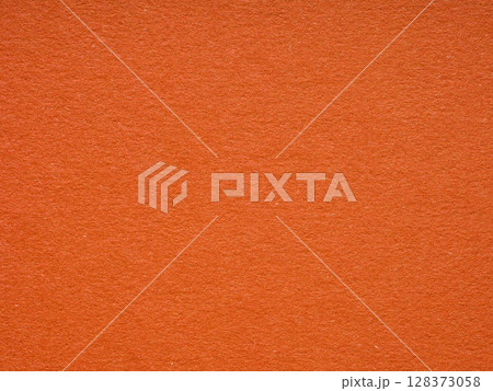 Fiery orange paper texture with a subtle fibrous detail, conveying warmth and creative vibrancy 128373058