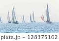 Sailing in morning haze. Regatta at the sea near the coast of Piraeus. 128375162