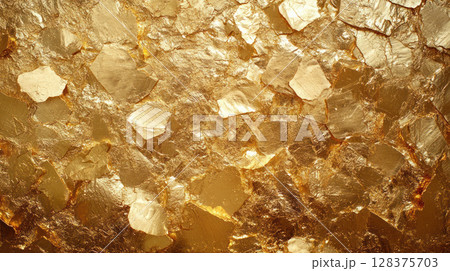 Gold texture background with shiny metallic surface and irregular shapes creating luxurious and rich visual effect 128375703