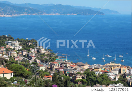 Camogli, Italy - 11 July 2025. Yachts, boats in bay of Liguria. Sea and tourism in Italy. Traditional buildings. Background for design. Camogli, Italy - 11 July 2025. Yachts, boats in bay of Liguria. Sea and tourism in Italy. Traditional buildings. Background for design. 128377091