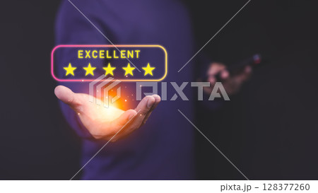 Male customer holding a glowing five star customer review, symbolizing high-quality service and positive customer satisfaction in online shopping, testimonial, and user experience evaluation. 128377260