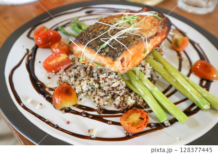 grilled salmon,salmon steak or fish steak and quinoa or rice grilled salmon,salmon steak or fish steak and quinoa or rice 128377445