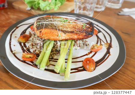 grilled salmon,salmon steak or fish steak and quinoa or rice 128377447