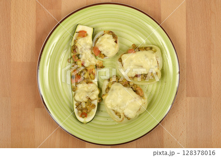 baked stuffed zucchini, bell peppers, and onions 128378016