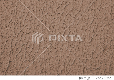 Rough brown colored concrete or plaster wall texture background 128378262