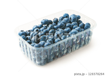 Fresh raw organic blueberries in transparent plastic box isolated on white background close up Fresh raw organic blueberries in transparent plastic box isolated on white background close up 128378264