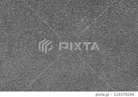 Grainy texture of gray colored asphalt, plaster, cement, plastic close up, macro background 128378266