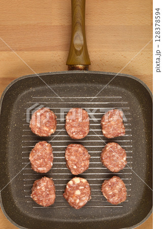 Savory minced meat and cheese patties 128378594