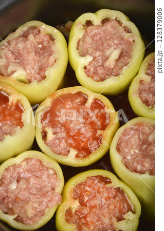 Green bell peppers stuffed with meat and rice mixture Green bell peppers stuffed with meat and rice mixture 128379006