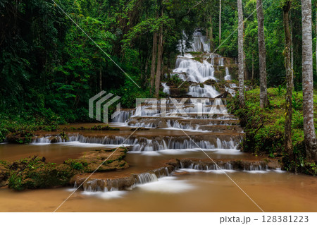Phacharoen Waterfall Beautiful waterfall in the middle of a tropical forest in Thailand 128381223