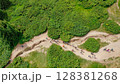 A top-down aerial view of young people walking along a mountain trail with backpacks to the top of the mountain. Hiking, climbing, traveling, trekking, backpacking. 128381268