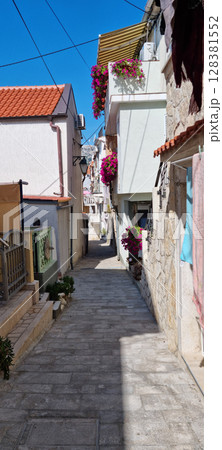 Narrow stone street in the old town of Baska 128381552