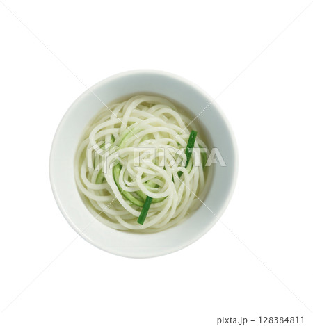 Somen - Thin wheat noodles typically served chilled with a light dipping sauce during the summer months. The noodles are 128384811
