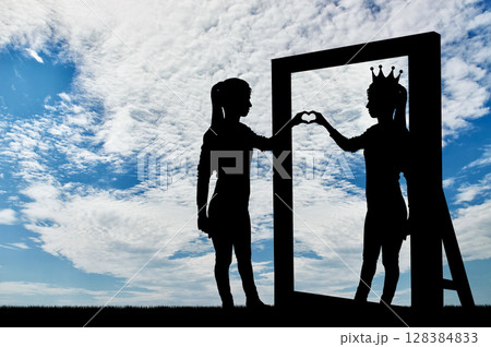 Silhouette of a narcissistic woman with a crown on her head and a hand gesture of the heart in reflection in the mirror. 128384833