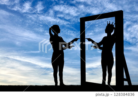 A silhouette of a narcissistic woman raises her self-esteem in front of a mirror 128384836