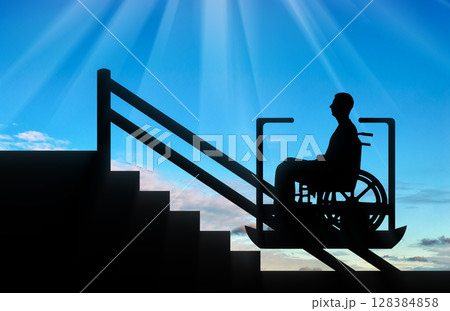 Disabled person climbs on elevator for disabled on stairs 128384858