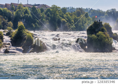 Rhine Falls or Rheinfall waterfalls, Canton Schaffhausen, Switzerland Rhine Falls or Rheinfall waterfalls, Canton Schaffhausen, Switzerland 128385346
