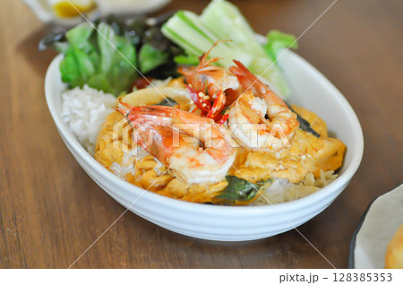 creamy omelet or omelet or omelette or fried egg with shrimp and squid or seafood omelette and rice 128385353