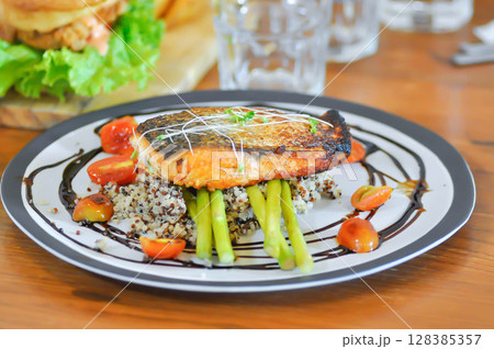 grilled salmon,salmon steak or fish steak and quinoa or rice 128385357