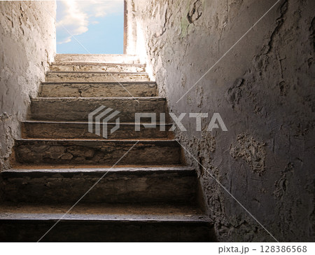 Steps from the dark basement to the light 128386568