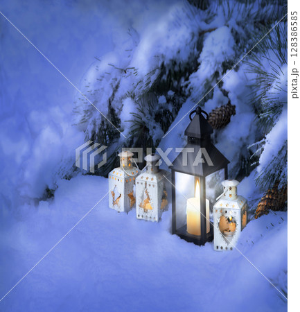 Lanterns in the snow under the Christmas tree Lanterns in the snow under the Christmas tree 128386585