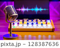 microphone on audio mixer and monitor showing waveform background 128387636