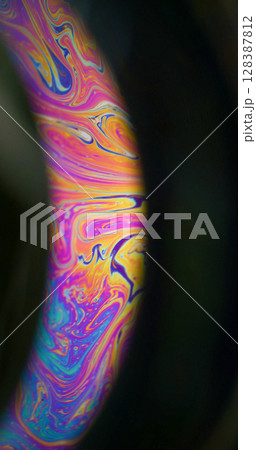 Rainbow oil. Paint mix. Multicolor round arch gasoline liquid blend pigment black background. Abstract blur purple orange blue glow fluid. Rainbow oil. Paint mix. Multicolor round arch gasoline liquid blend pigment black background. Abstract blur purple orange blue glow fluid. 128387812