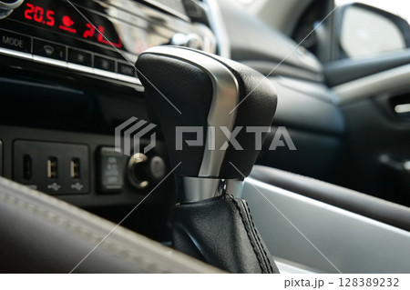 Transmission Shifter With Aluminum Elements In Leather Car Interior Closeup Stock Photo 128389232