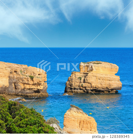 Limestone cliff near shore (Algarve, Portugal). 128389345